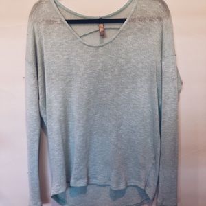 Woman’s light blue sweater
